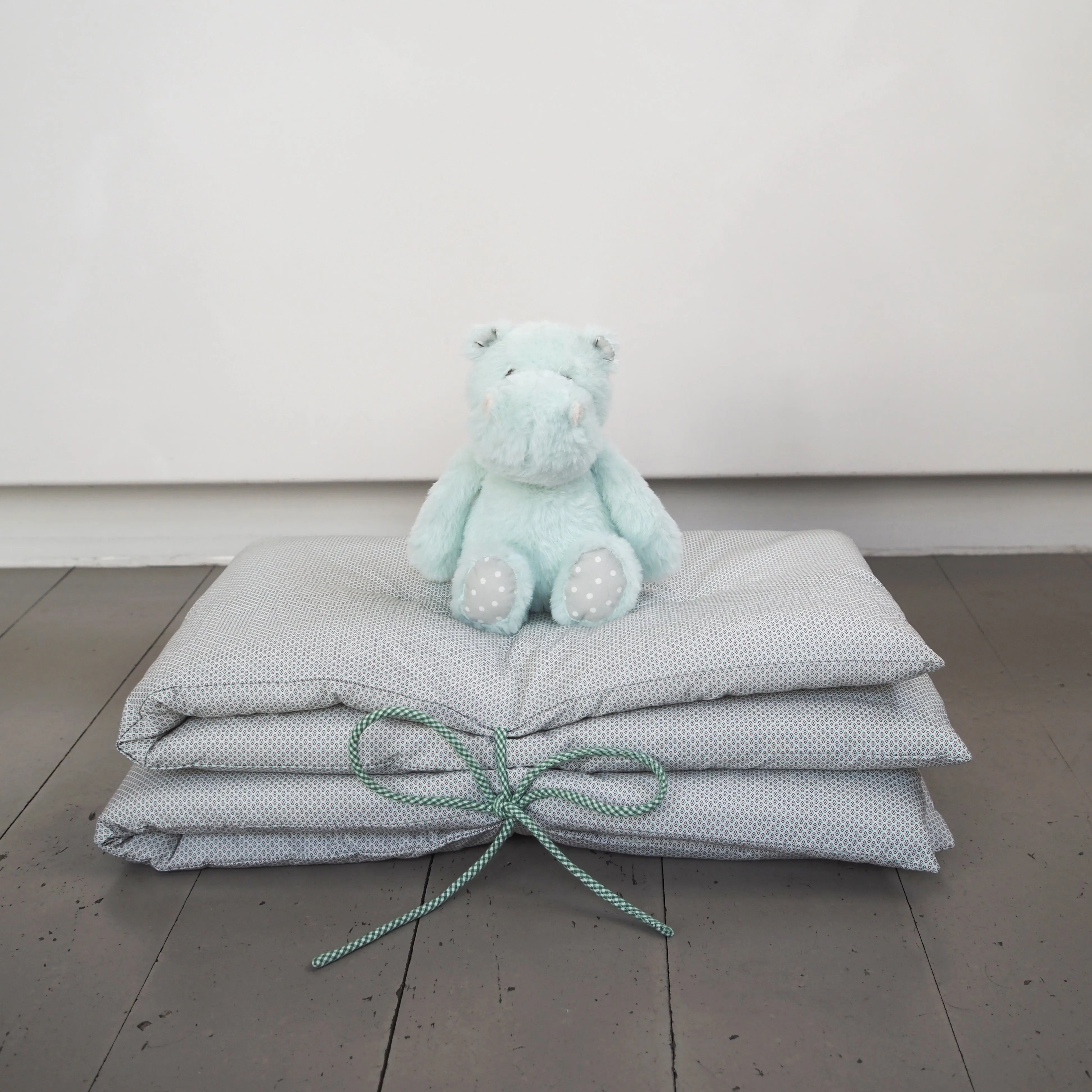Lifestyle Image: Hettie the Hippo Toy and Poesy Quilt